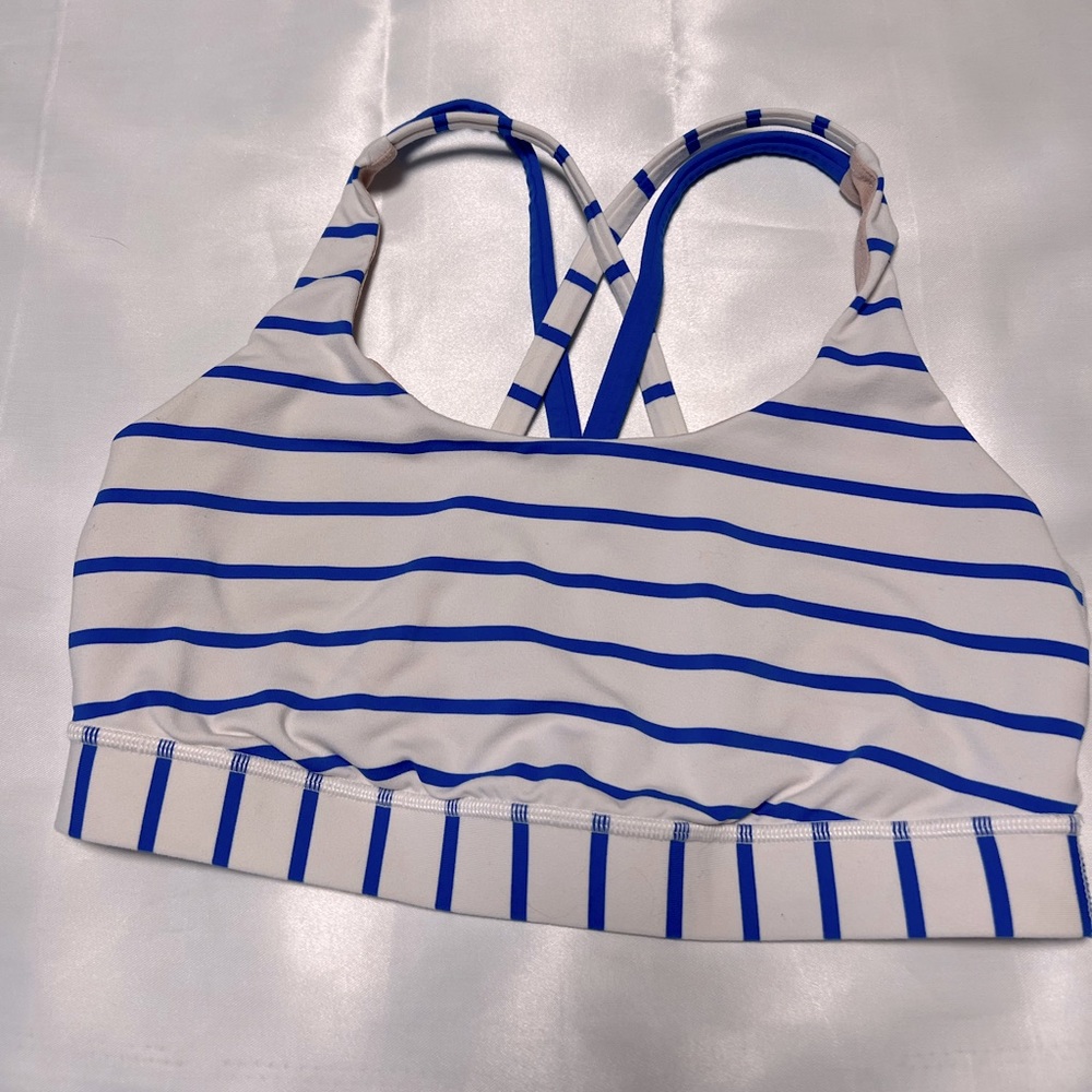 Lululemon sports bra in a vibrant blue and white stripe pattern